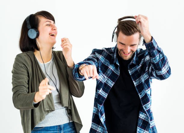 istock Couple enjoying the music isolated 1016048696