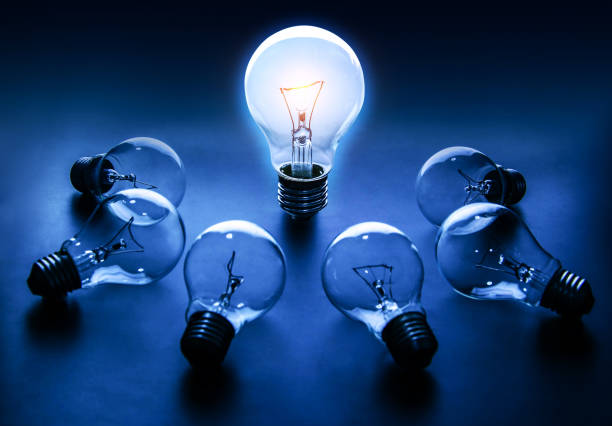 istock Light bulb lamps on a colour background 1016049580