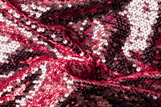 istock top view of red and silver iridescent textile with shiny sequins as background 1016049712