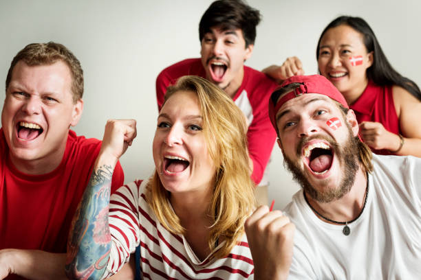 Friends cheering world cup with painted flag