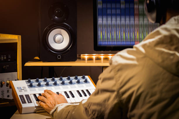 istock producer hands playing midi keyboard for recording in home studio 1016061344