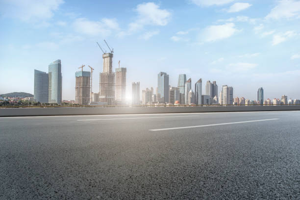 istock Empty highway asphalt road with Qingdao urban architecture landscape skyline 1016070750