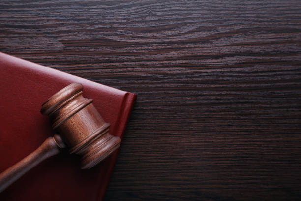 istock Judge gavel with book on wooden table 1016070860