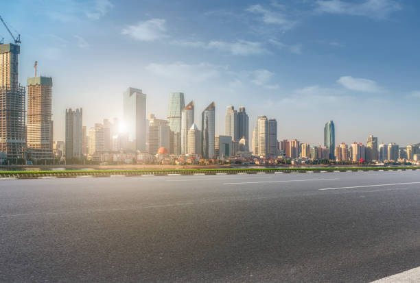 istock Qingdao modern construction commercial building office building with prospect highway asphalt pavement 1016071338