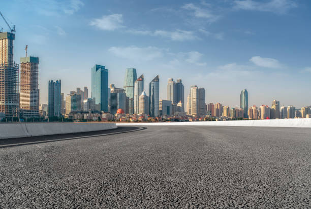 istock Empty highway asphalt road with Qingdao urban architecture landscape skyline 1016071416