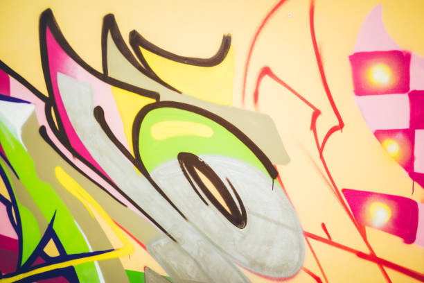 istock Colorful graffiti on an orange wall 1016074000