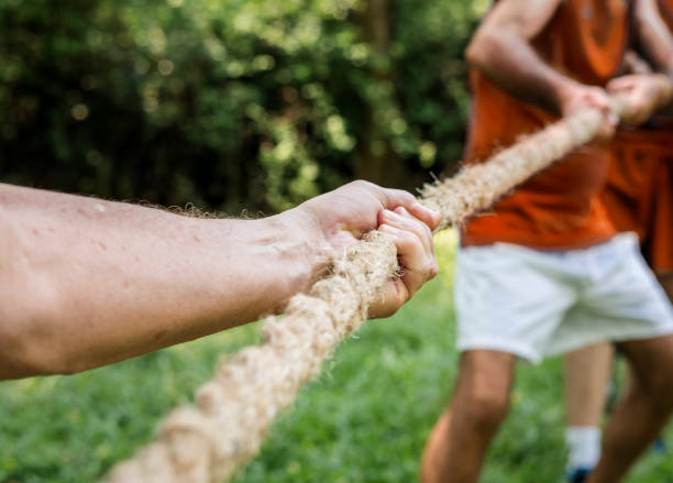 istock Mature people in tug of war 1016074010