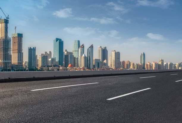 istock Empty highway asphalt road with Qingdao urban architecture landscape skyline 1016074014