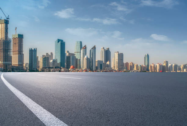 istock Empty highway asphalt road with Qingdao urban architecture landscape skyline 1016074212