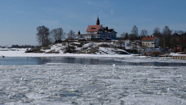 istock Broken Ice on sea in Finland Houses 1016074288