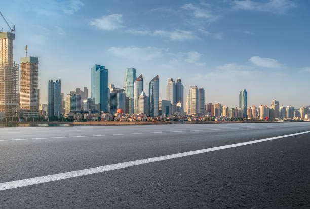 istock Qingdao modern construction commercial building office building with prospect highway asphalt pavement 1016074292
