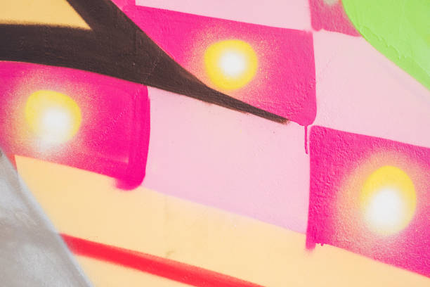 istock Colorful graffiti on an orange wall 1016074556