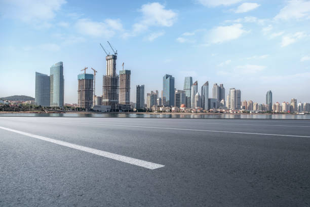 istock Empty highway asphalt road with Qingdao urban architecture landscape skyline 1016074856