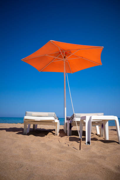 istock Red beach umbrella Rhodes island Greece 1016075466