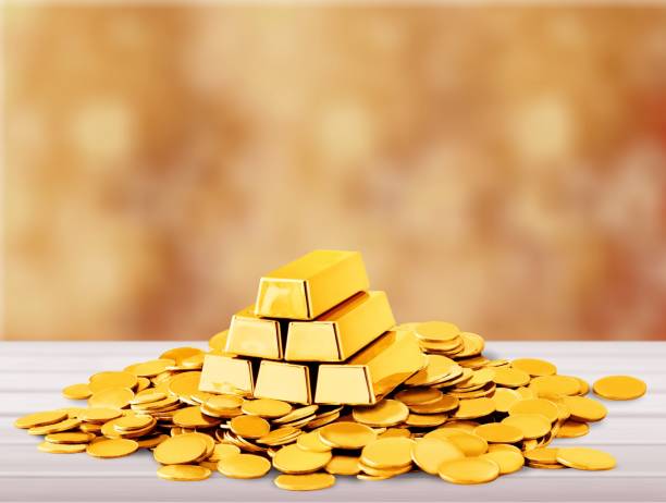 Gold. Gold bars and coins on backgrouund gold ira reviews stock pictures, royalty-free photos & images