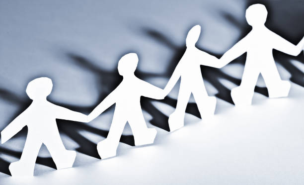 istock Paper people in teamworking concept 1016078572