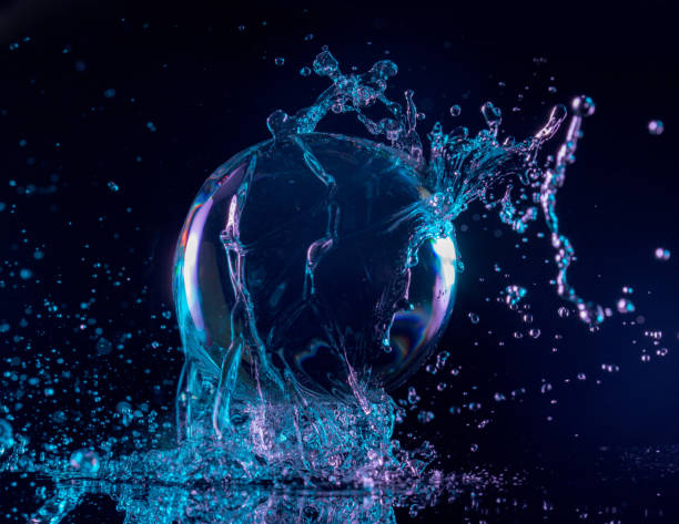 water splashing on a floating ball - floating on water fotos imagens e fotografias de stock