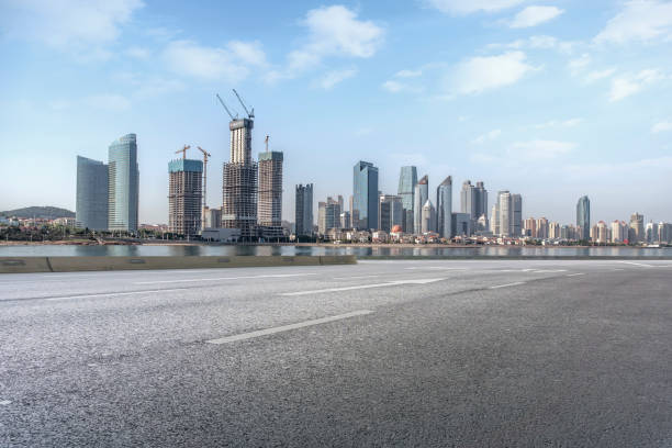 istock Empty highway asphalt road with Qingdao urban architecture landscape skyline 1016078868