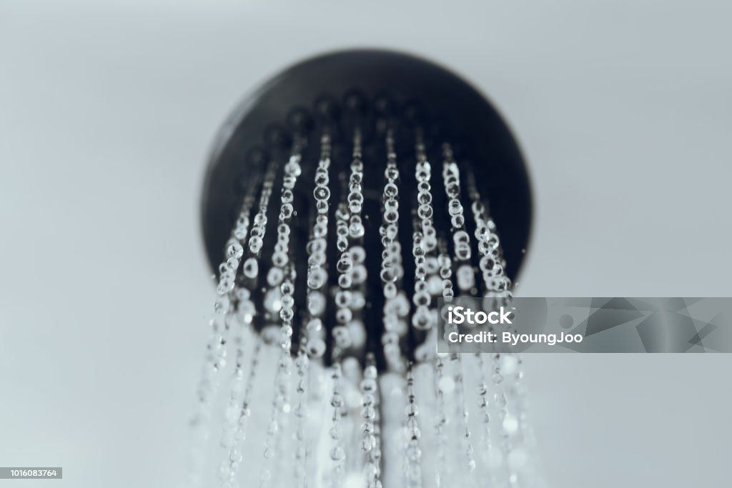 shower head with water drop flowing. Shower Stock Photo