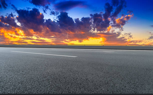 istock Asphalt road with sky clouds landscape 1016084452