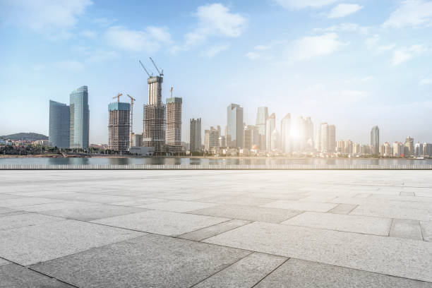 istock Empty Square Floor Tiles and Qingdao CBD Architectural Landscape Skyline 1016094692