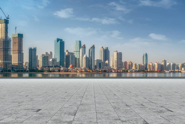 istock Empty Square Floor Tiles and Qingdao CBD Architectural Landscape Skyline 1016094730