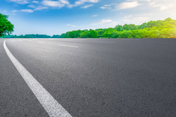 istock Empty highway asphalt road and beautiful sky landscape and forest 1016103530