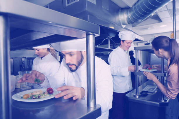 istock Staff of restaurant with head chef working 1016108320