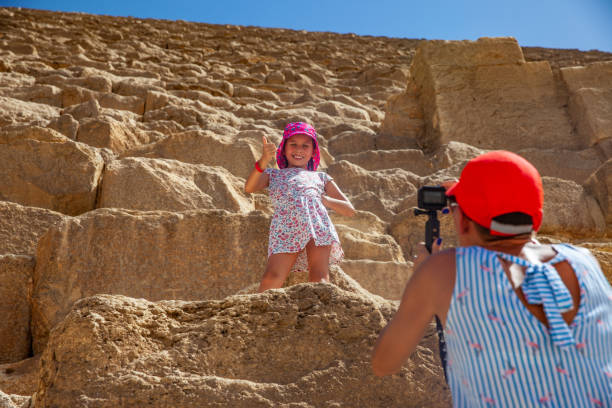 Mother Capturing an Image of Her Daughter on Kheops Pyramid.