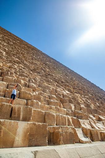 Adult Female Tourist Enjoying Exploring Kheops Pyramid.