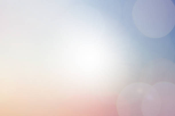 istock blurred beautiful natural pastel background lens ray flare flash light. 1016125640