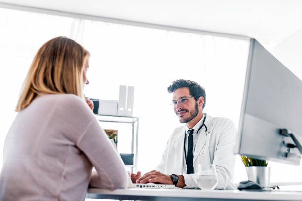 istock Doctor talking with patient in meeting room 1016129148