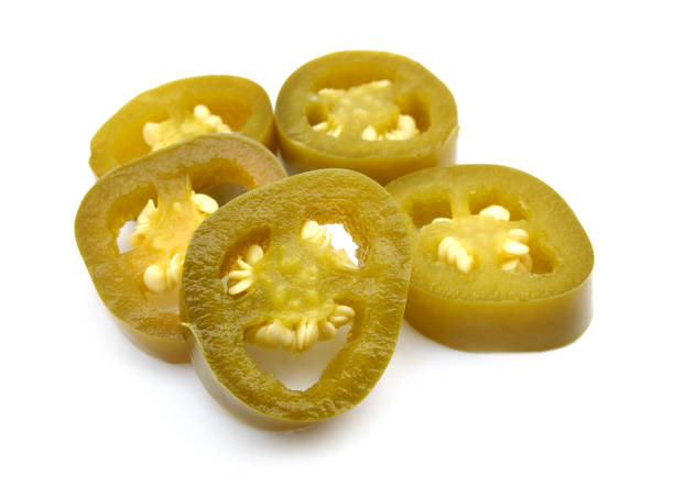 pickled sliced Jalapeno Peppers isolated on White Background
