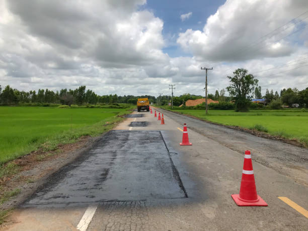 istock Road repair. Damage caused by heavy trucks. 1016134522