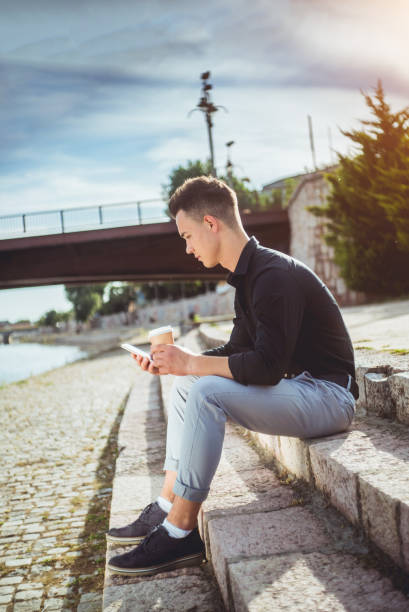 istock With Phone and Coffee To Go 1016137384