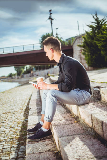 istock With Phone and Coffee To Go 1016137472