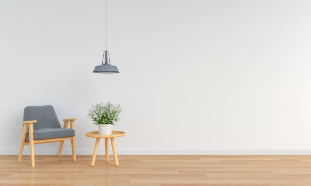 istock grey armchair in white room for mockup, 3D rendering 1016148786