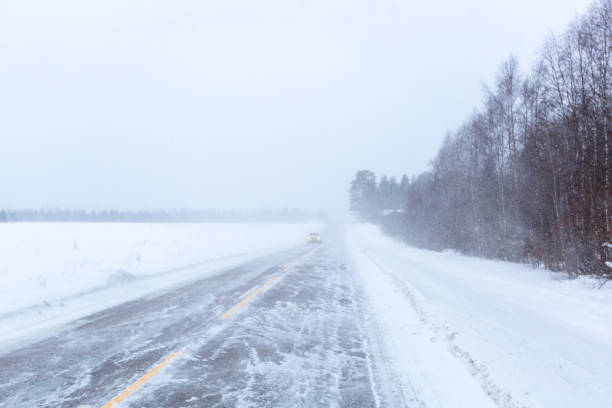 istock Snowy day on the road in Finland 1016152398