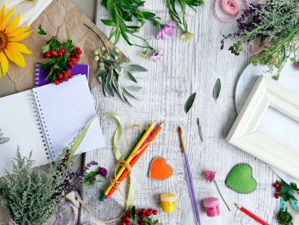 istock easonal decorative composition of flowers, berries, art and clerical materials 1016155016