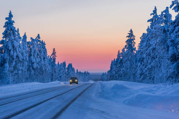 istock Evening on the winter road in Finland 1016157664