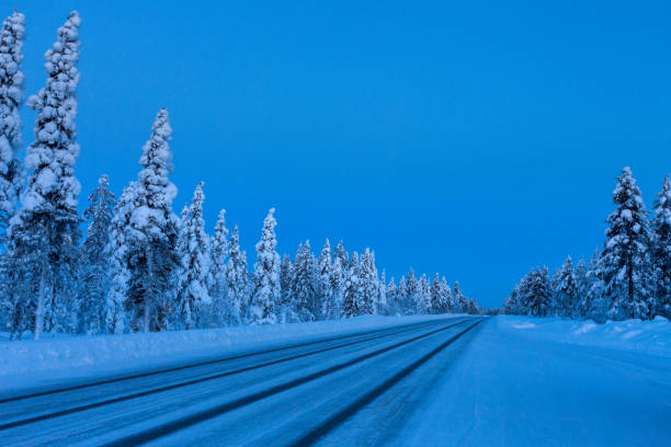 istock Evening on the winter road in Finland 1016158050