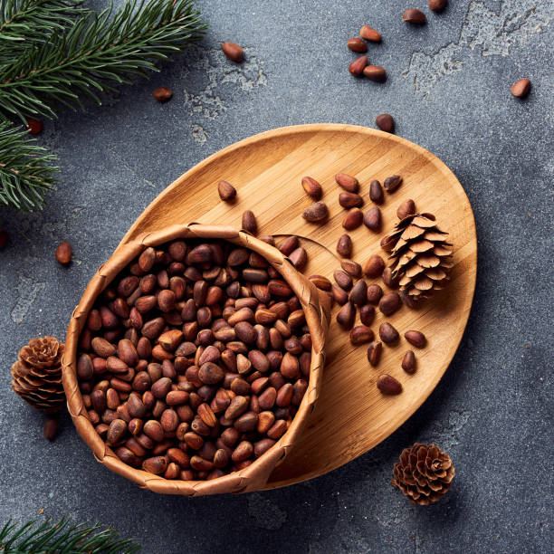 istock Pine nuts in bowl on gray stone table. Top view. 1016160854