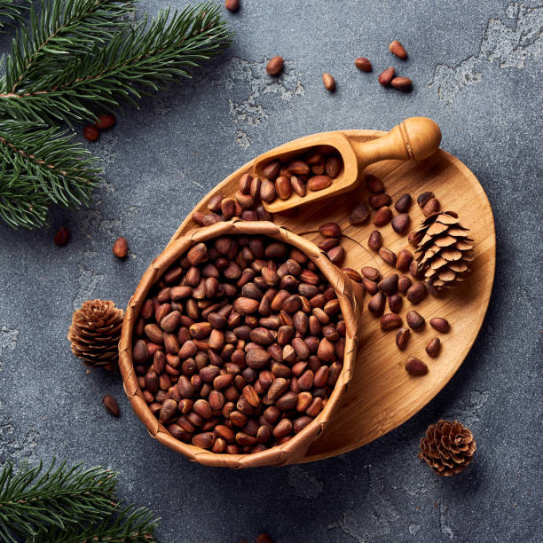 istock Pine nuts in bowl on gray stone table. Top view. 1016161090