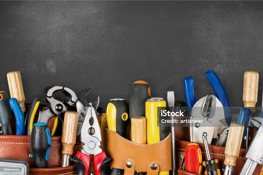 Tool. Tool belt with tools on wooden background Work Tool Stock Photo