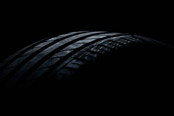 istock Studio shot of a black car tires 1016168306
