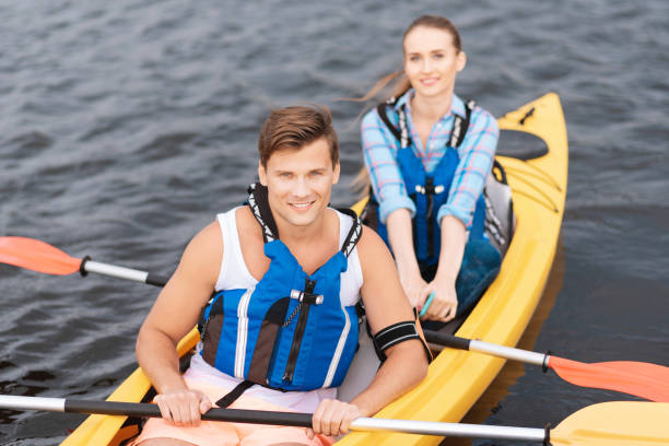 istock Handsome man enjoying sport activity while rowing in canoe 1016168646