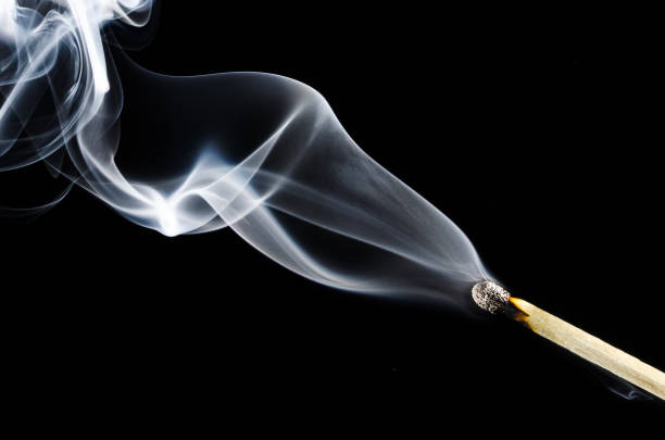 istock Smoke Swirling from Burnt Wooden Matchstick 1016168760
