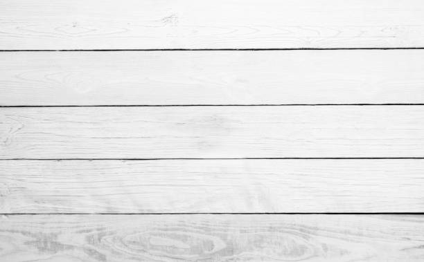 istock Table top view of wood texture over white light natural color background. Grey clean grain wooden floor teak panel backdrop with plain board pale detail streak finishing for chic space clear concept. 1016169020