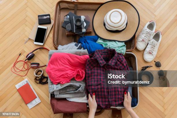 Woman Hand Preparing Summer Luggage Stock Photo - Download Image Now - Suitcase, Packing, Luggage