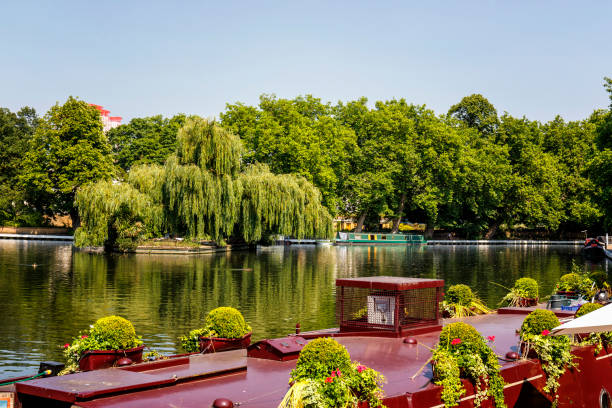 Narrow boats moored at Regent's Canal in Little Venice London London, England - June 19, 2017: Narrow boats moored at Regent's Canal in Little Venice London little venice london stock pictures, royalty-free photos & images